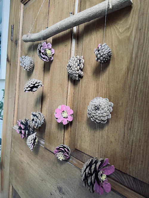 The Heather and Frost pine cone mobile