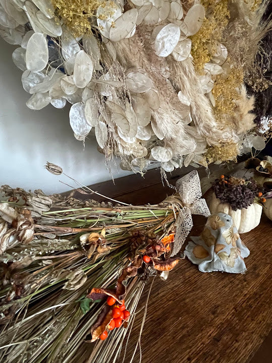 Witch's dried flower broom - orange seedpods and beige bow