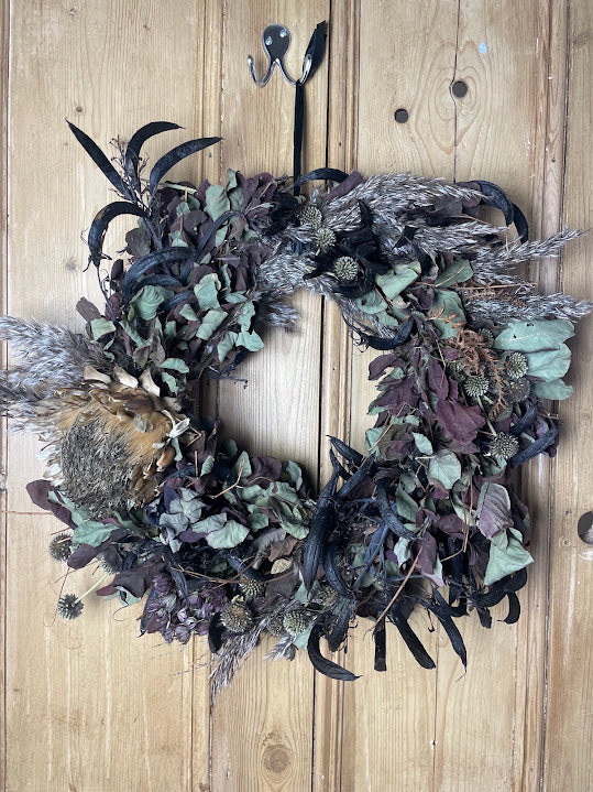 Halloween wreath made with wolf's tail and witches fingers. 45cm.