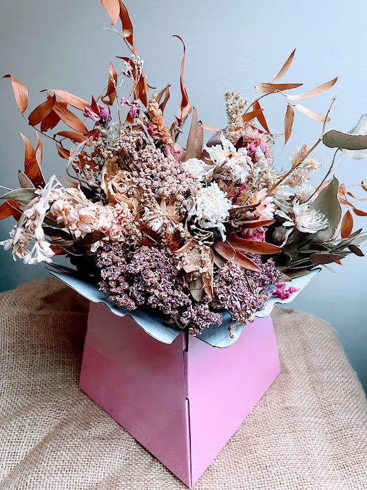 Rose gold and copper bouquet in pink hat box