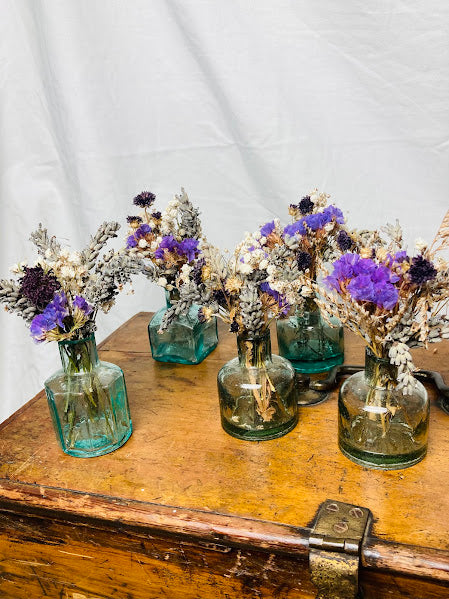 Collection of 5 purple posies in antique aqua coloured ink wells